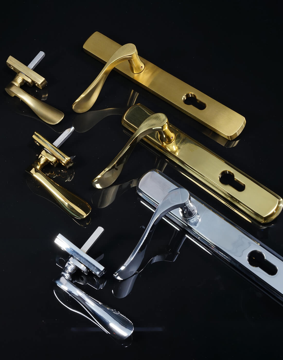 Set of matching premium stainless steel door and window handles on a black background